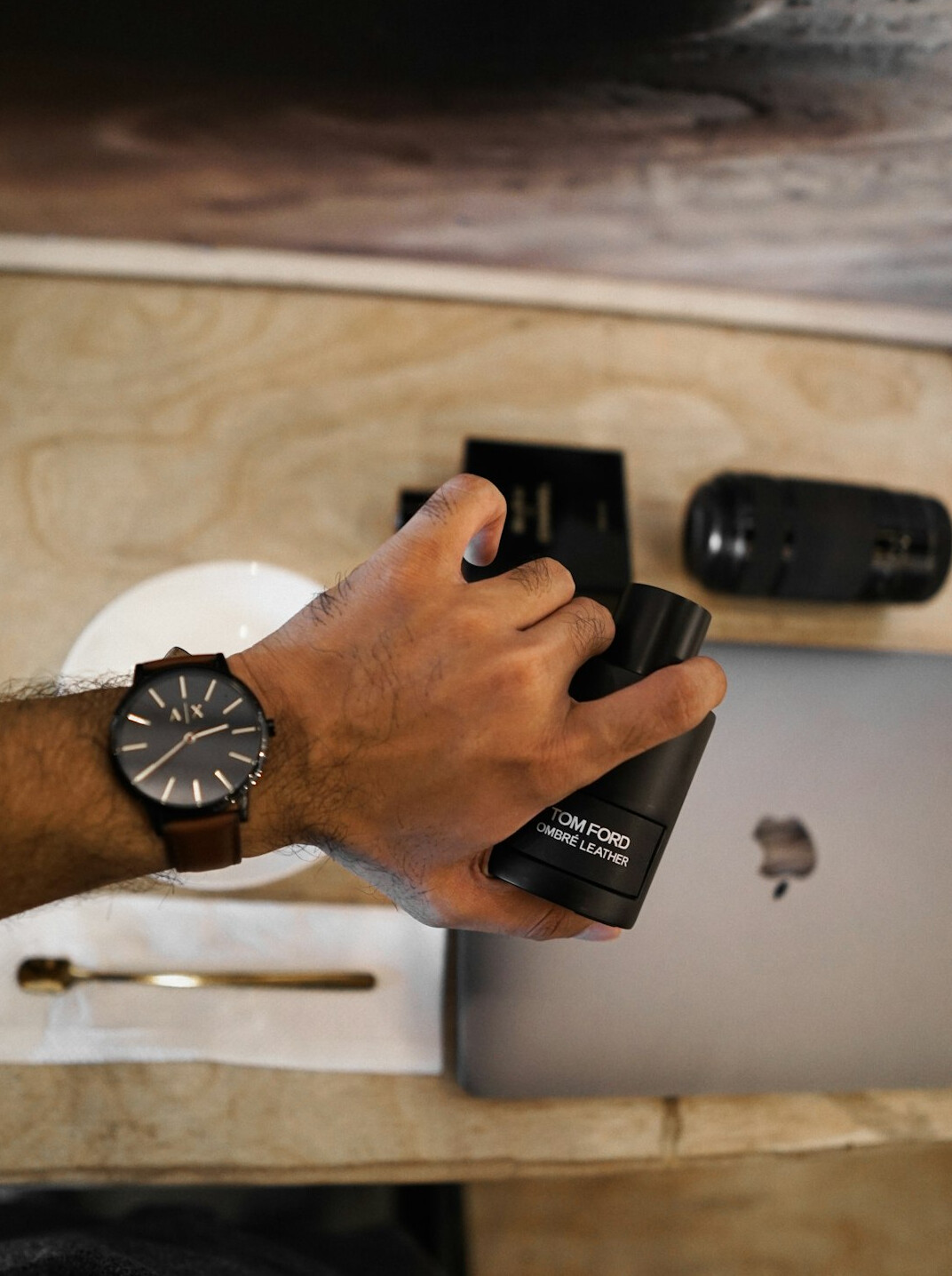 Laptop on a desk with hands typing