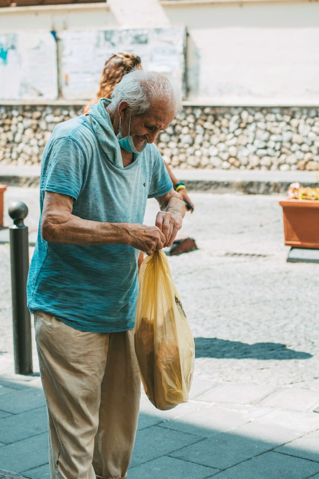 elderly shopper with bag