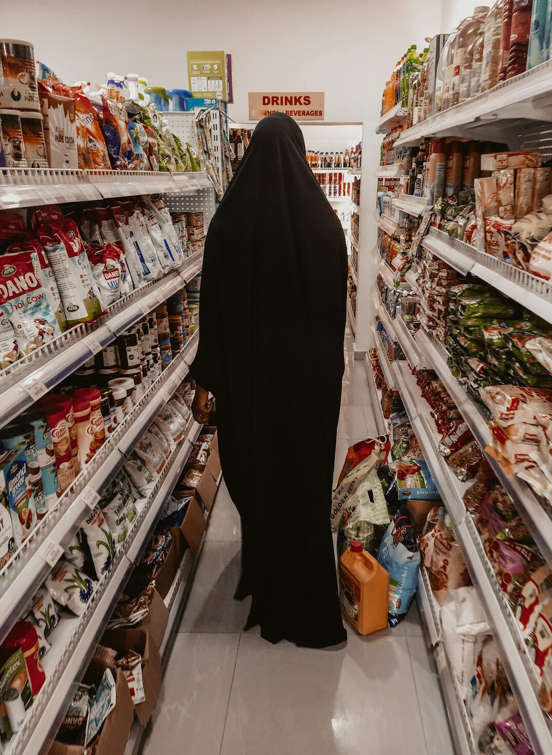 store detective watching shoppers