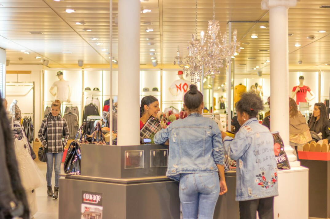 group of shoppers in mall